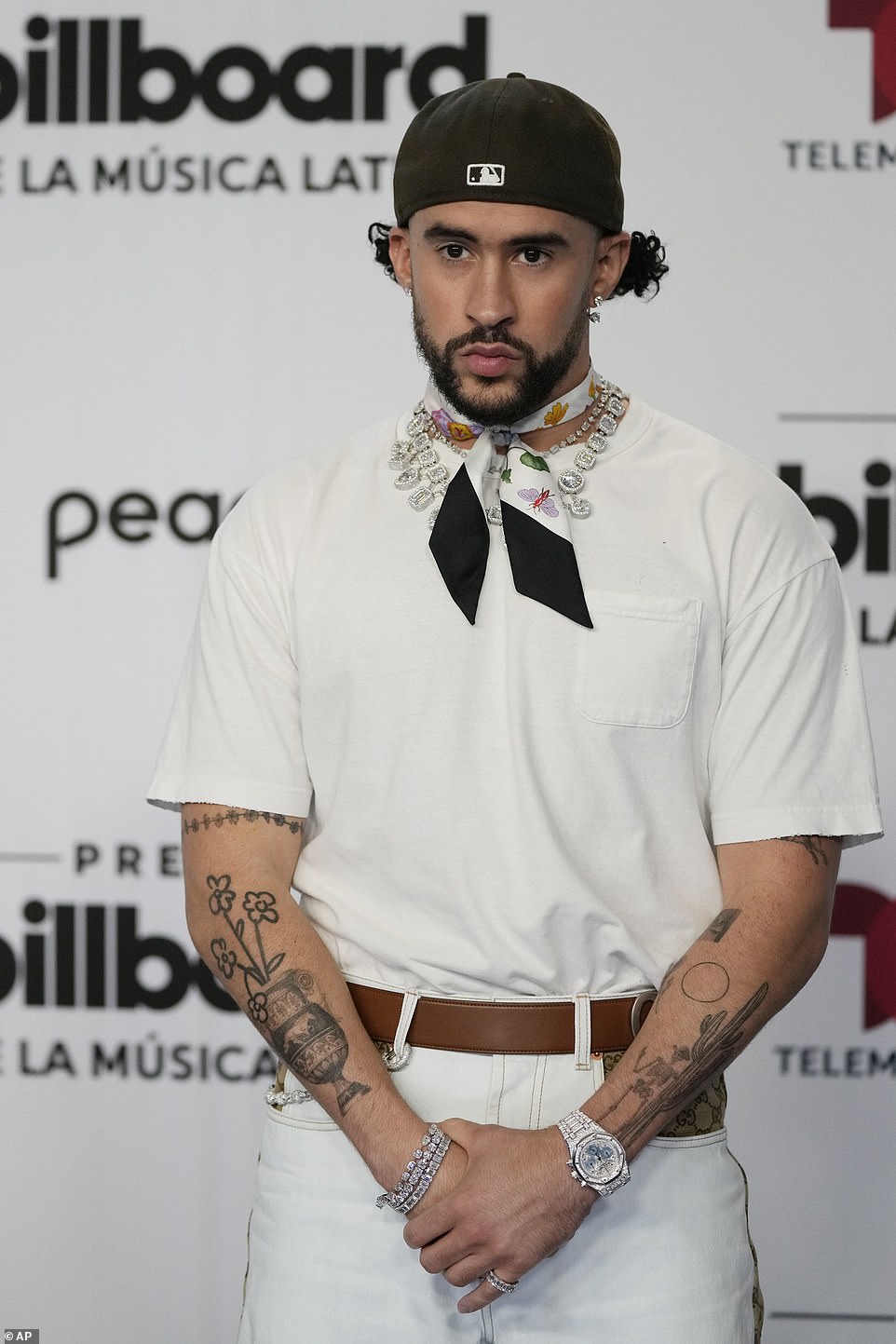 Style standout!  The Puerto Rican superstar wore a dazzling crystal necklace and a silky floral bandana around his neck