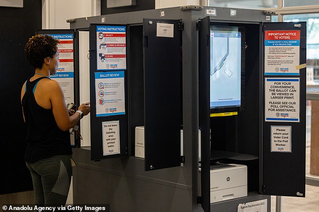 Voting machines are on display in Georgia during the 2022 midterm elections. In separate defamation lawsuits, Dominion is seeking $1.3 billion in damages from Lindell and his pillow company, and Smartmatic is seeking an unspecified amount of damages.