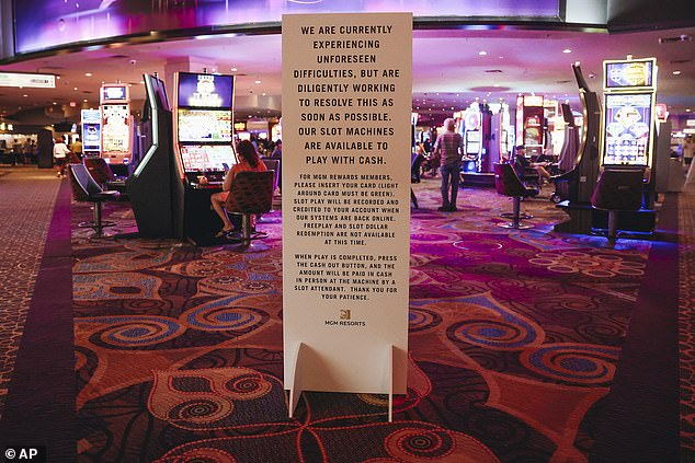 A sign warns guests of slot machine issues after a hack targeting MGM Resorts International at the Luxor hotel-casino on September 13