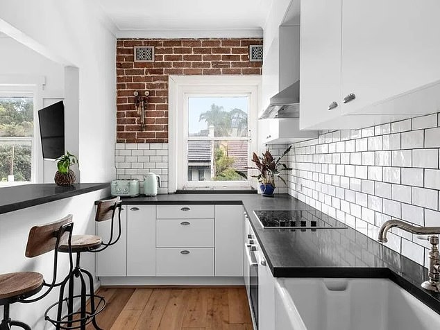 Highlights include a spacious, bright layout and a new kitchen with Caesarstone worktops, serving window and breakfast bar (pictured)