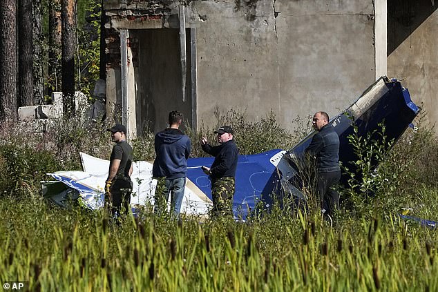 The executive Embraer aircraft then plummeted to Earth, killing Prigozhin, his bodyguards and other Wagner commanders.  In the photo: - Russian investigators search the site of a plane crash near the village of Kuzhenkino on August 24 this year