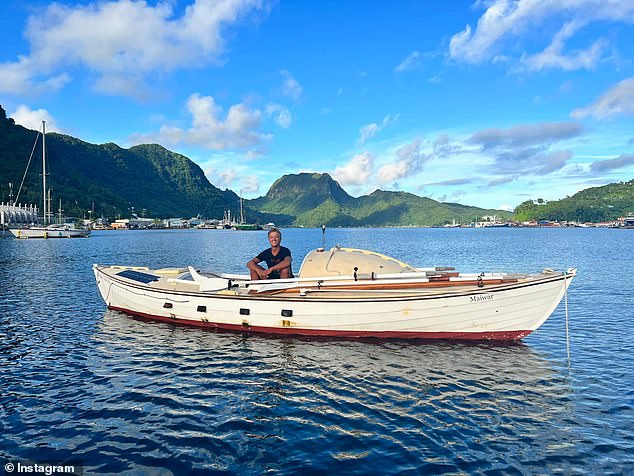 Mr Robinson (pictured on his boat in Samoa) was found burned and dehydrated but was otherwise fine