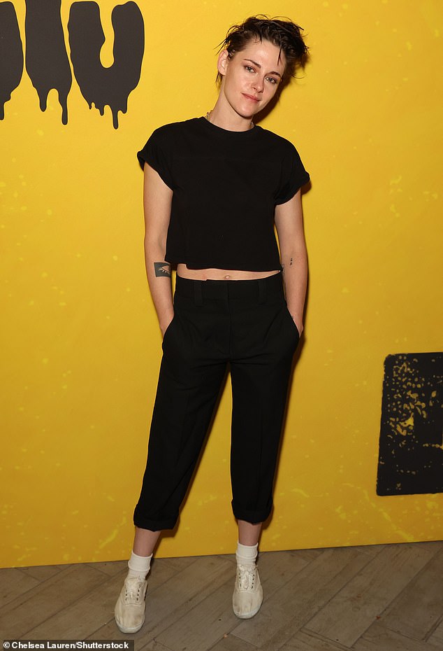 Rocker chic: The actress paired her top with cropped black pants and wore white sneakers and socks for the evening