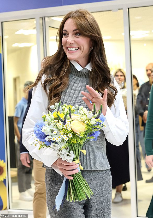 Princess Kate smiled and waved as she left the community center with her bouquet of flowers themed around Ukrainian colors