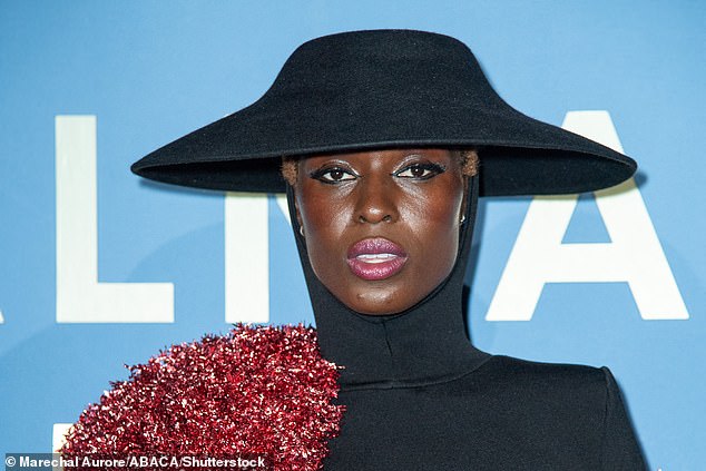 A vision: She wore the hat and bodysuit with a bold makeup look