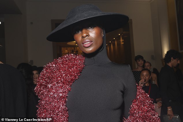 Hats off to you!  She wore a wide-brimmed hat with a hood attached to her bodysuit underneath