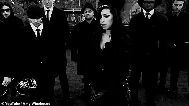 Gloomy: Directed by Phil Griffin, the black-and-white music video for the somber jazz track portrays Amy attending a funeral service for an apparently failed romance