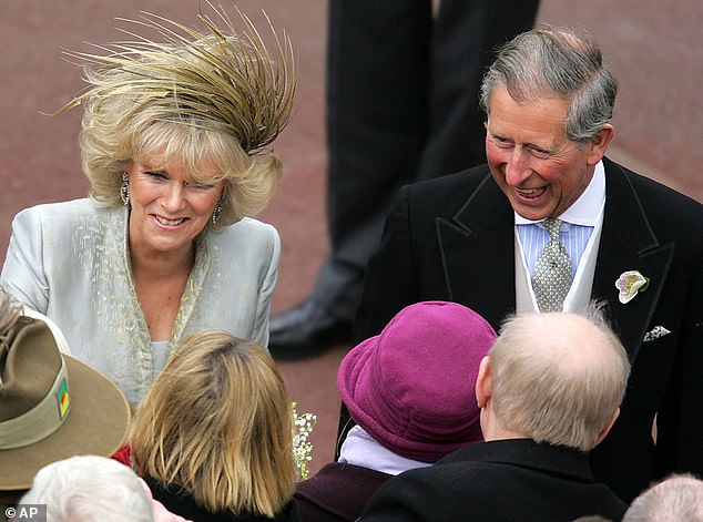 Queen Elizabeth and the Duke of Edinburgh attended the blessing that followed at St George's Chapel, Windsor.  The Queen wore white, but by then Camilla was wearing grey