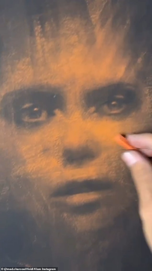 Creepy: Set to eerie music, the video showed artist Josh Hernandez painting a lifelike image of the Klum