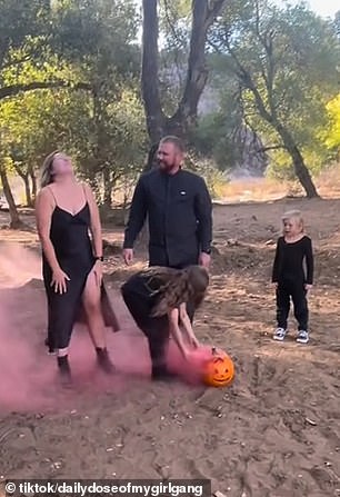 The video begins with Kendra, her husband and her three daughters standing around a Jack-O-Lantern