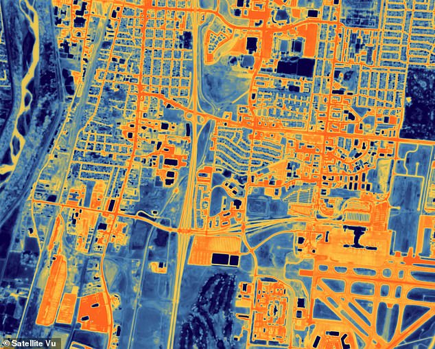 Airport in Albuquerque, New Mexico, with aircraft to the right of the image.  A golf course at the bottom of the image is relatively cooler