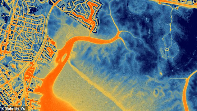 Darwin Australia: The orange area is the sea, rivers and estuary and the darker area at the top is the marina.  Water retains its heat very well, making it appear very warm (orange)