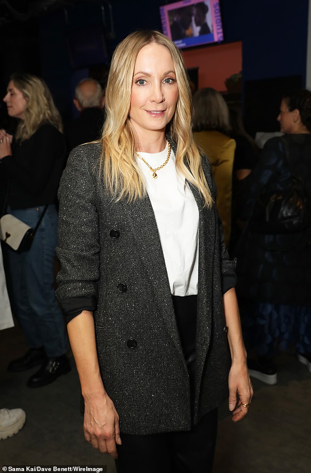 Looking good: Downton Abbey star Joanne, 43, wore a charcoal gray jacket over a white top which she paired with flared black trousers