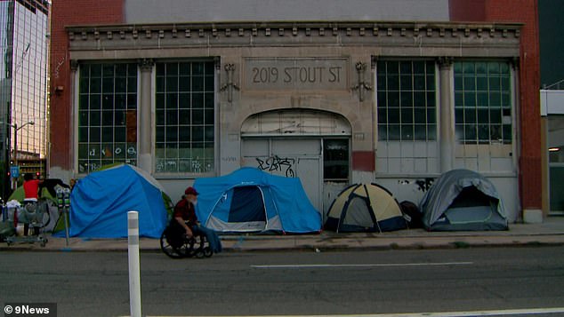 Tents are seen across the street from the Triangle Bar, which the owners say is now surrounded by encampments, open drug use and crime