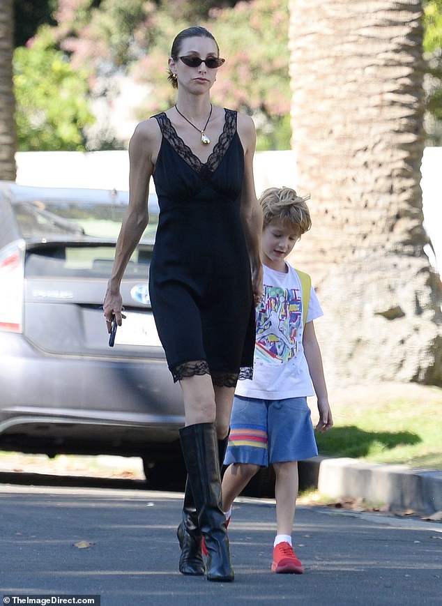 Doting mum: The Hills alum was spotted holding the hand of her son, who looked cute in shorts and a t-shirt