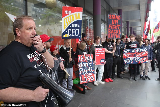 Coles and Woolworths said they passed on pay rises recommended by the Fair Work Commission to workers in July (pictured)