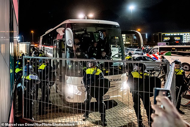 Two Legia Warsaw players were taken from their team bus and arrested after their Europa League match