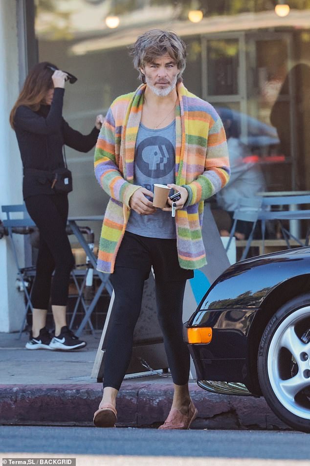 Unique: Along with his more colorful new look, the Hollywood leading man was dressed in a very colorful cardigan over a gray PBS T-shirt, with black shorts over matching leggings and yellow slip-on shoes