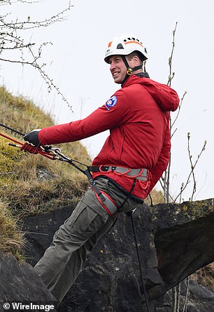 The father-of-three rappels as part of training activities during a visit to Central Beacons Mountain Rescue Team in April