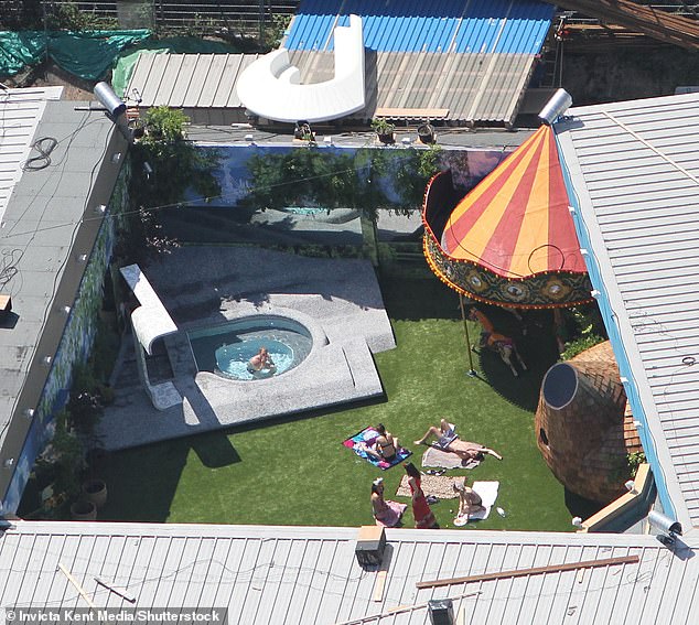 An aerial view of housemates in the garden of the Big Brother house in 2010 in Elstree, Hertfordshire.  Home 2023 is located in Garden Studios, a newly built studio in West London