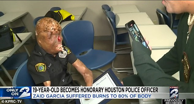 Mr. Garcia is pictured above after being presented with a certificate making him an honorary member of the Houston Police Department