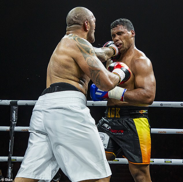 Tevita Pangai Junior takes a punch from Frank Amato in their six-round fight.  The former Bulldogs NRL star won on points in a thrilling clash that was easily the best fight on the card