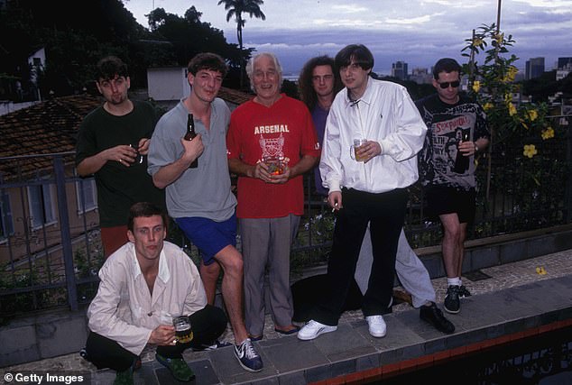 Former Happy Mondays tour manager Anthony Murray said he was 'lucky to be alive'.  Pictured left to right: Bez (crouching), Paul Ryder, Anthony Murray, Gary Whelan, Ronnie Biggs, Gary Whelan, Shaun Ryder and Paul Davis