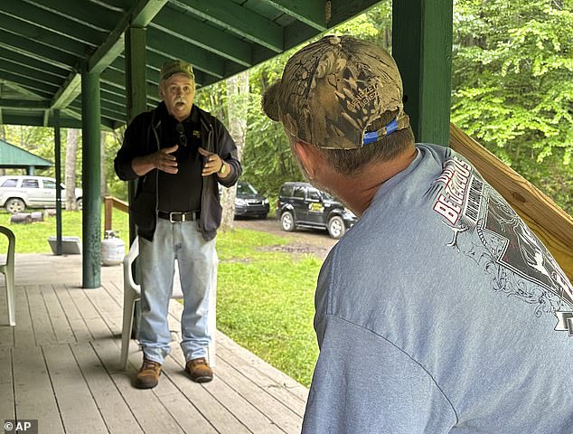 Treasure hunter Dennis Parada, left, and elk guide Eric McCarthy are shown at a hunting camp in Penfield on Aug. 23, 2023.