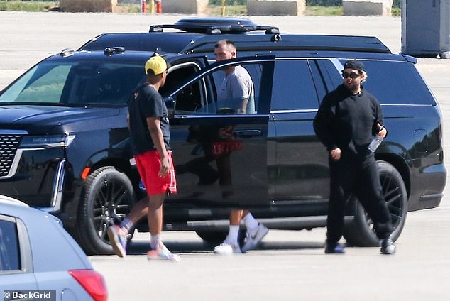 Taking care of business: The professional football player cut a casual figure as he jumped into his SUV before leaving the Kansas City Chiefs training facility in the company of his friends, although he eventually returned to his teammates after just an hour