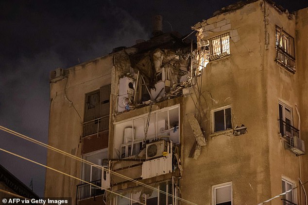 A building in Tel Aviv was damaged by a rocket fired by Palestinian militants from the Gaza Strip on October 7