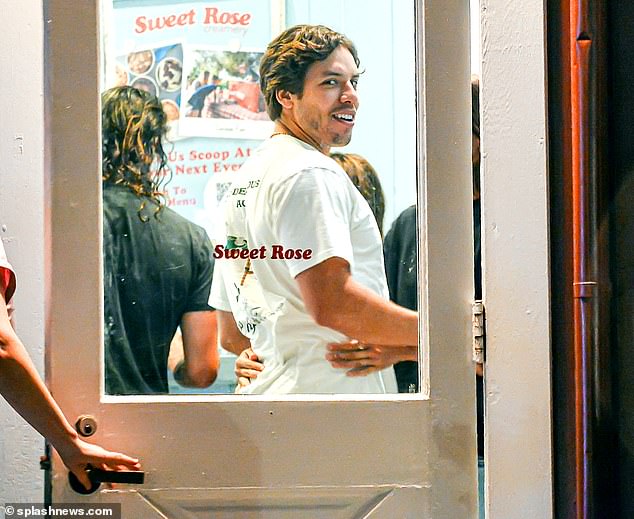 Caught on camera: The model looked ready to strike a pose at an ice cream shop while waiting for an order