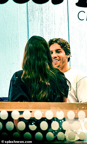 Smile for days: The Gunners star couldn't stop smiling as he looked at his girlfriend of four years