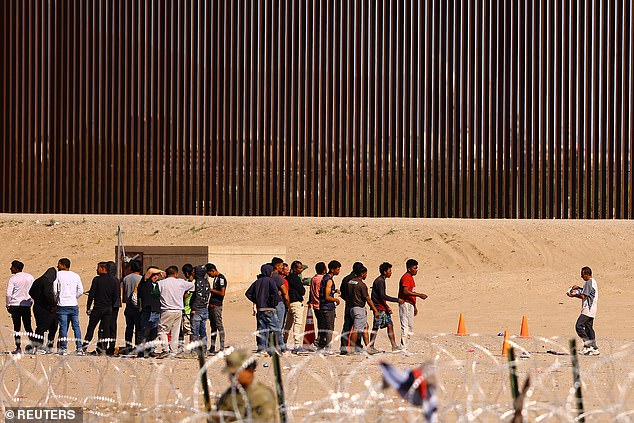 Biden's administration said Thursday it would add sections to a wall to reduce the record number of migrant crossings at the US-Mexico border