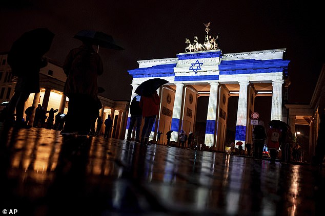 The Brandenburg Gate was illuminated with the Israeli flag at night