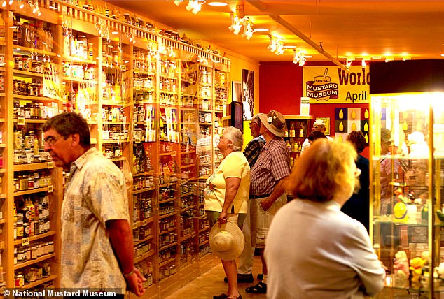 Visitors browse the vintage mustard bottles, cans and jars that can be found inside the National Mustard Museum in Wisconsin