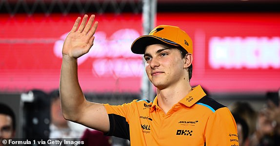 LUSAIL CITY, QATAR - OCTOBER 08: Oscar Piastri of Australia and McLaren wave to the crowd during the drivers' parade before the Qatar F1 Grand Prix at Lusail International Circuit on October 08, 2023 in Lusail City, Qatar.  (Photo by Clive Mason – Formula 1/Formula 1 via Getty Images)