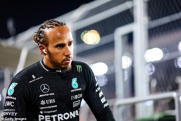 Lewis Hamilton shows his disappointment following the collision with his teammate