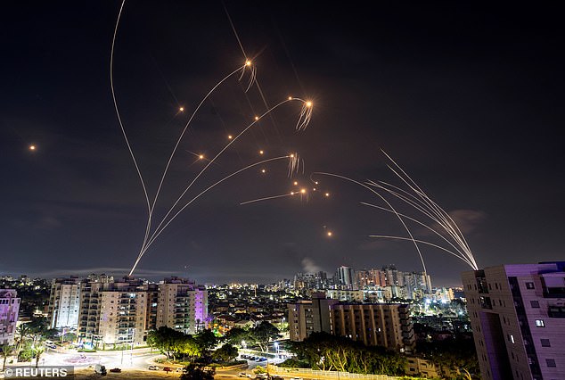 Israel's Iron Dome anti-missile system intercepts rockets launched from the Gaza Strip, as seen from Ashkelon in southern Israel early Sunday