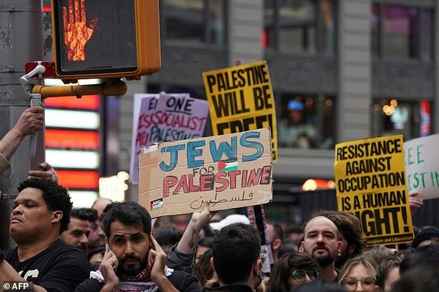 About a thousand protesters gathered in Manhattan's Times Square on Sunday to express support for the Palestinian people and to push against continued US military aid to Israel