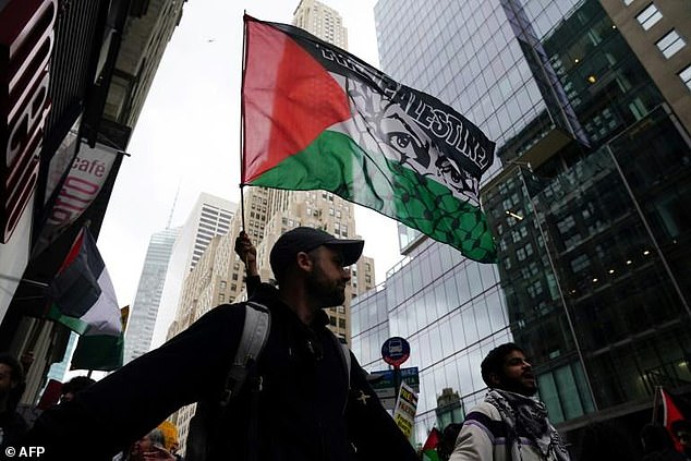 Protesters in New York waved Palestinian flags during the peaceful march from Times Square to near both the Israeli consulate and the United Nations headquarters, where the Security Council was due to meet on the weekend's violence