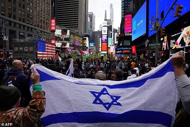 Supporters of Israel face people rallying in support of Palestinians in Times Square on October 8, 2023 in New York