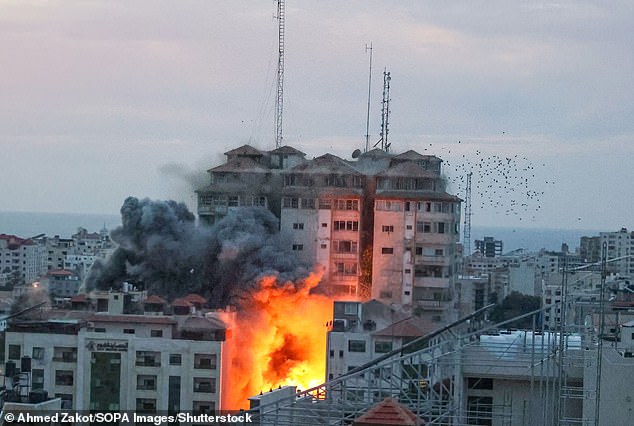 Last night Israeli forces said more than 400 Hamas fighters had been killed in the last 24 hours in retaliation.  Smoke and flames rise after Israeli forces launch an airstrike on Gaza City