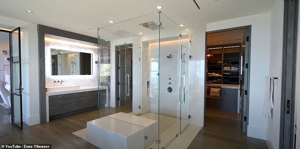 Off the master bedroom is an equally impressive bathroom with a central walk-in shower and freestanding bath.