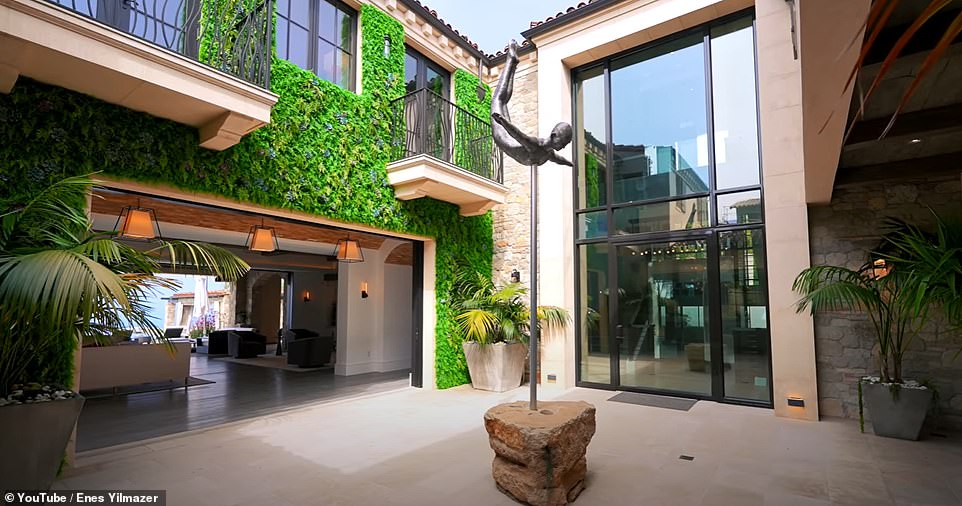 Entering the house, Enes walks through the central courtyard which he says 'brings natural light and fresh air to all the rooms on the first floor as well as the second floor'