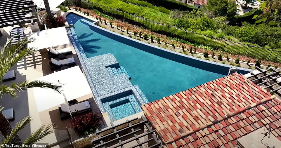 The pool has swim up bar seating so swimmers can grab drinks from the lower level bar for the ultimate sip and dive experience