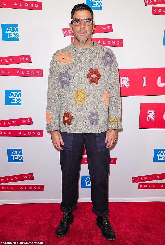 Appearance: Zachary Quinto stood out as he wore a gray crew-neck sweater that featured several floral-style designs on the front and sleeves