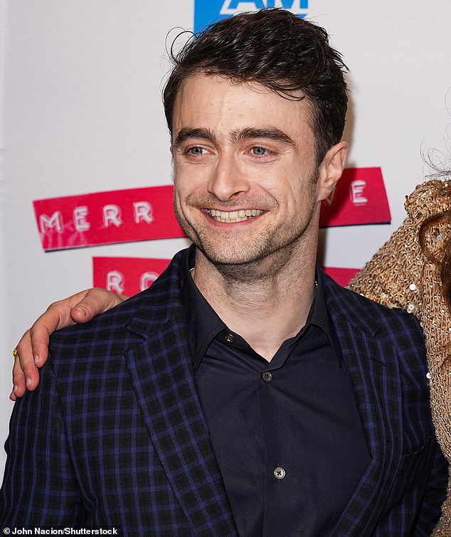 Matching: The star of the Harry Potter franchise opted for a plaid jacket worn over a black button-down shirt