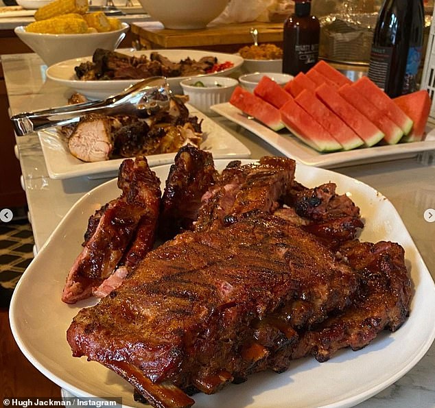 Meat treat: Hugh tucks into giant plates of meat while enjoying a night out with pal