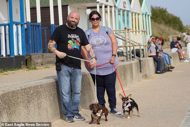 The annual walk which ended at Southwold Pier.  Pictured: Two excited dog owners