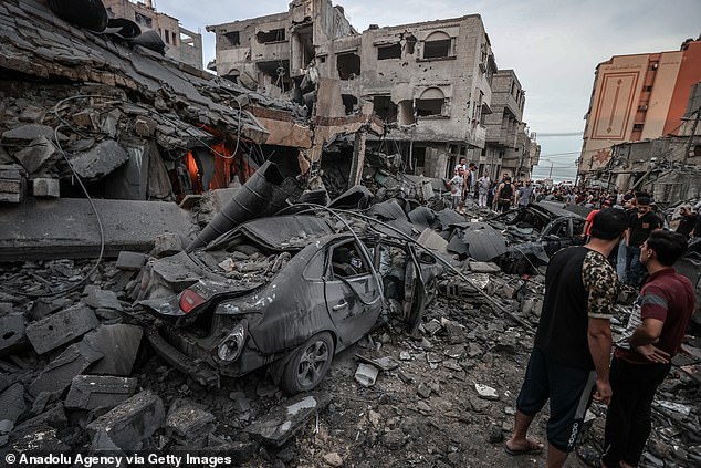 Israeli airstrikes destroyed buildings and cars at the al-Shati refugee camp in the Gaza Strip on Monday